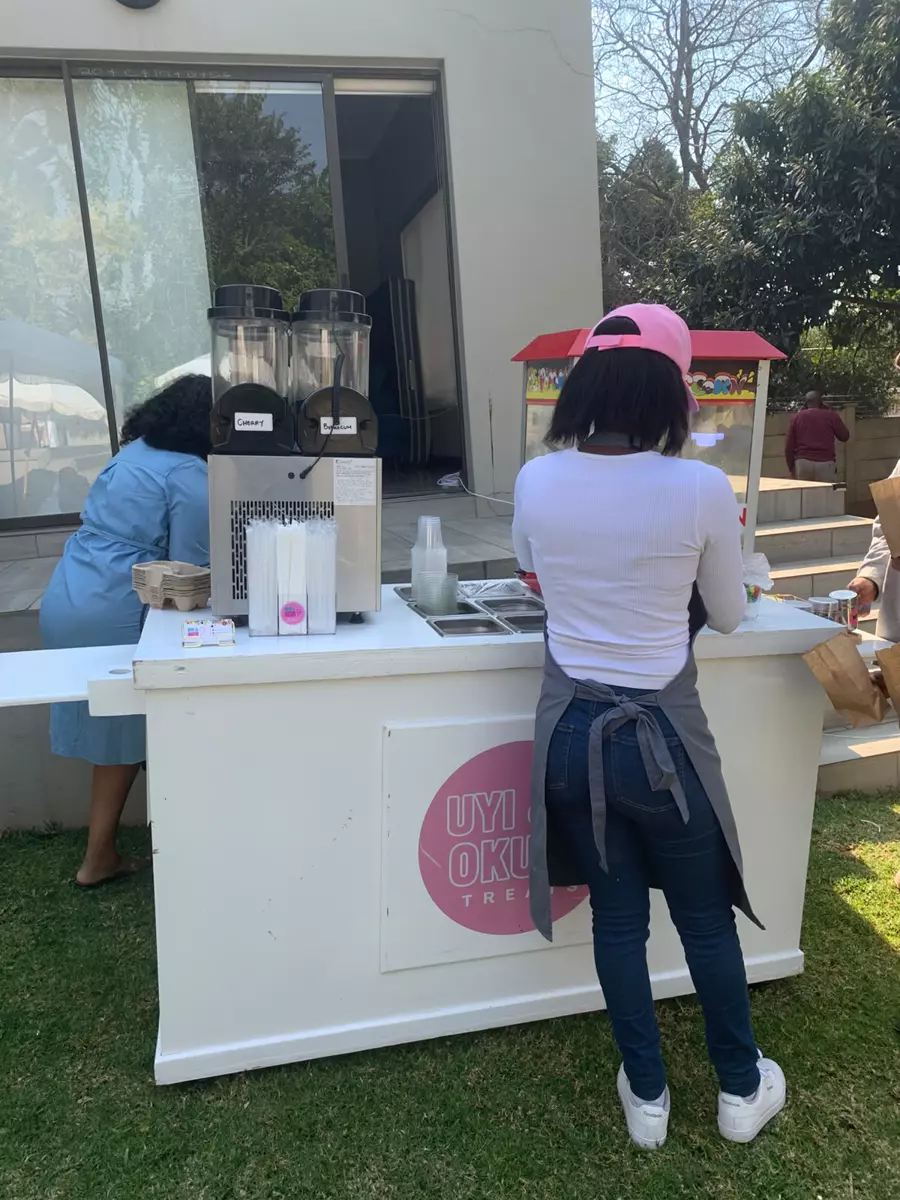 Serving slush and popcorn from the treat cart