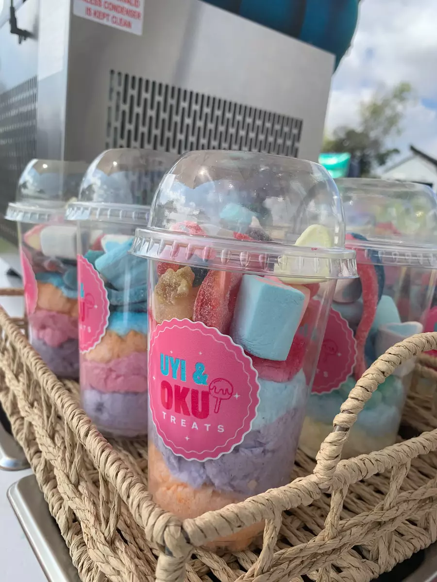 Cotton candy cups topped with gummy sweets