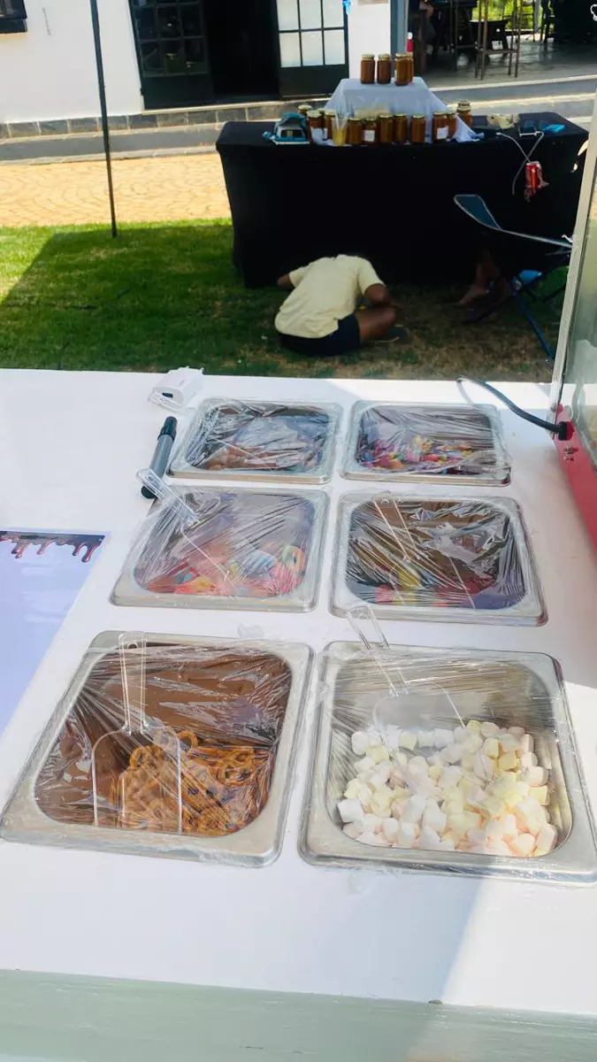 Toppings bar with marshmallows, pretzels and sweets